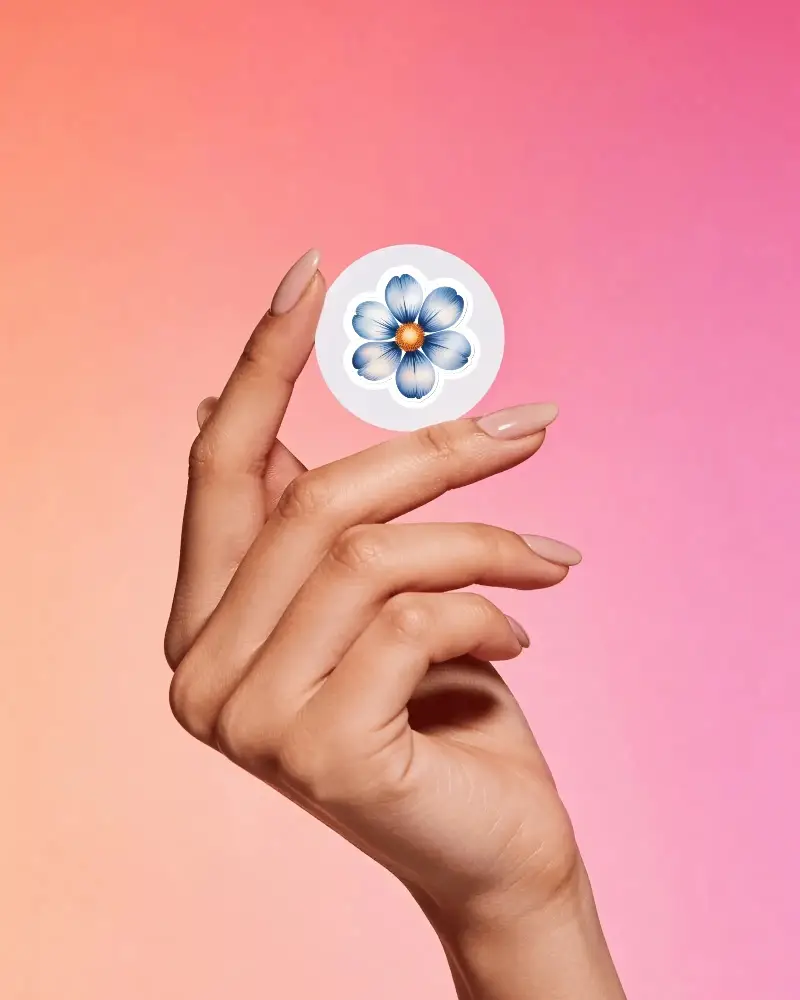 Hand Holding Round Sticker Mockup Against Gradient Background For Design Presentation