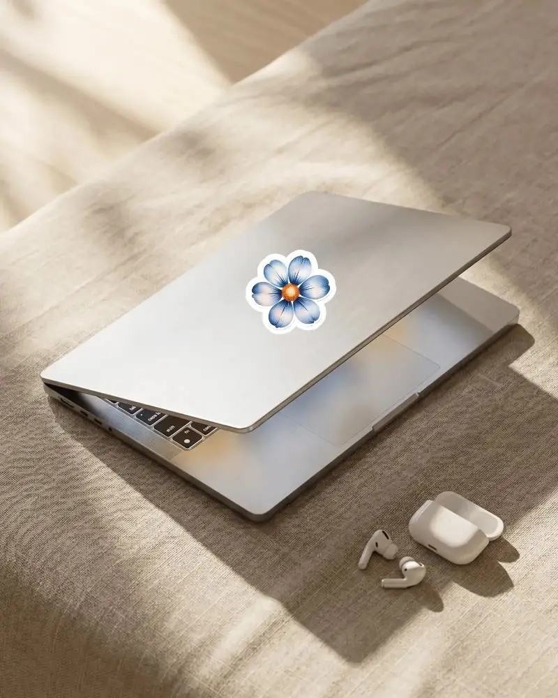 Modern Portable Laptop Sticker Mockup With Earbuds In Open Charging Case On Soft Textured Surface