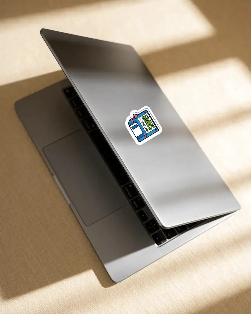 Sticker On Modern Laptop Partially Open Minimalist Digital Device On Textured Surface