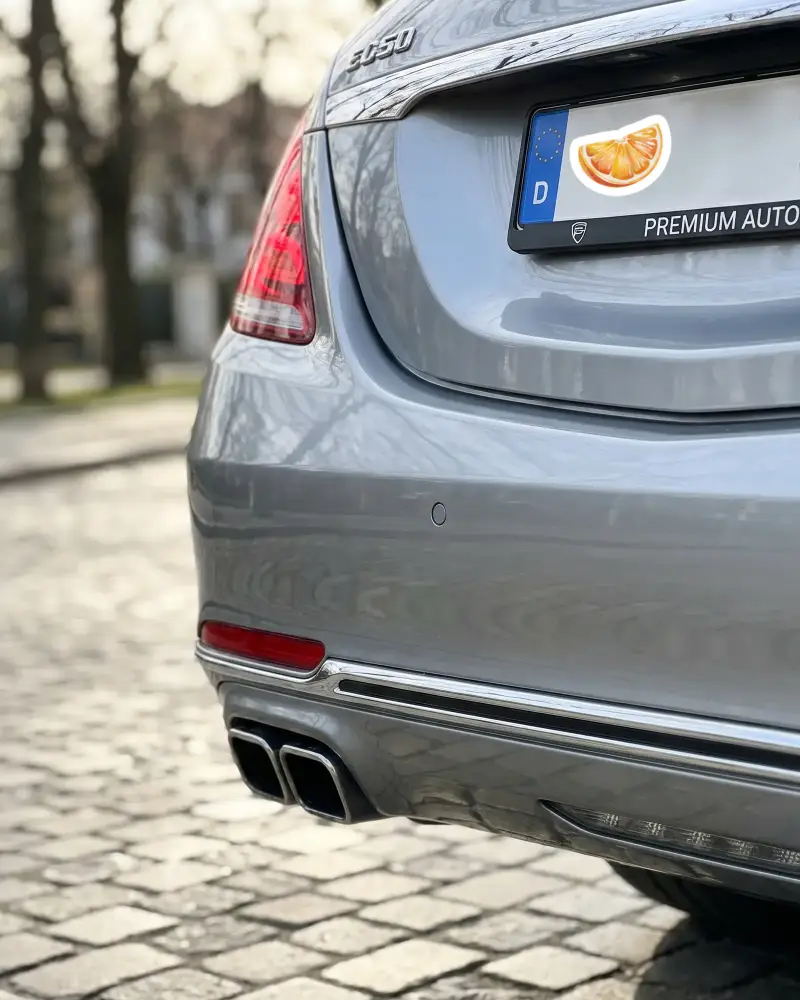 Closeup View Of Dual Sticker Mockup Exhaust Pipes On Premium Vehicle Rear Ready For Highway Driving