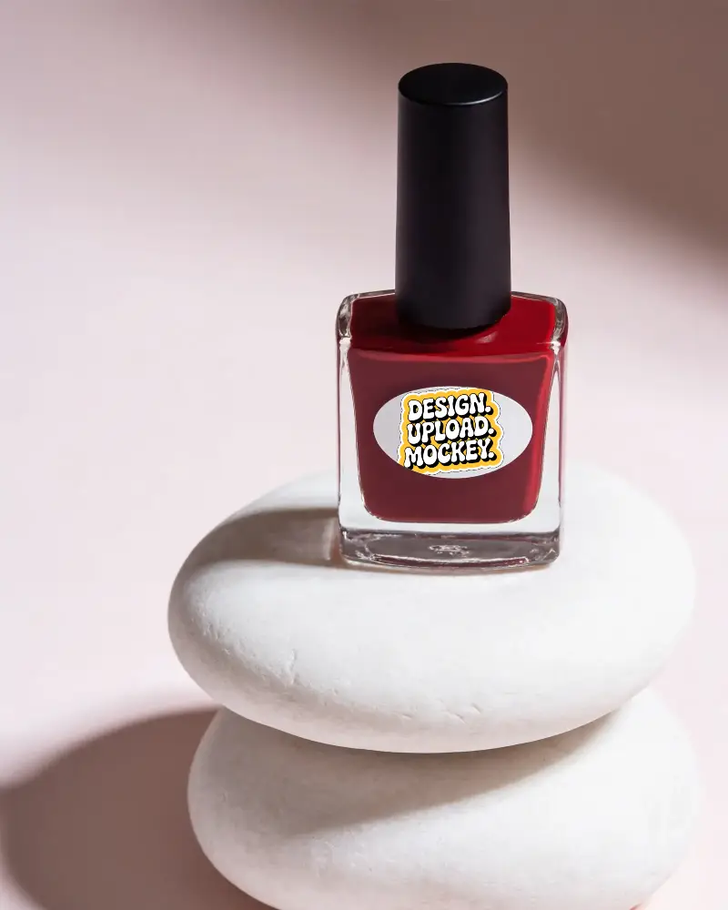 Nail Polish Bottle With Blank Oval Sticker Mockup On Natural Stone Pedestal