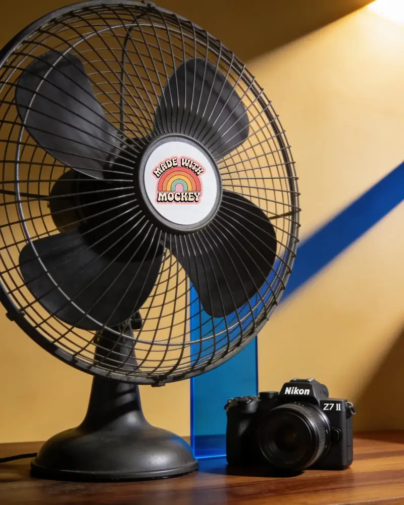 Classic Metal Table Fan Next To Professional Dslr Camera Under Soft Lighting Sticker Mockup