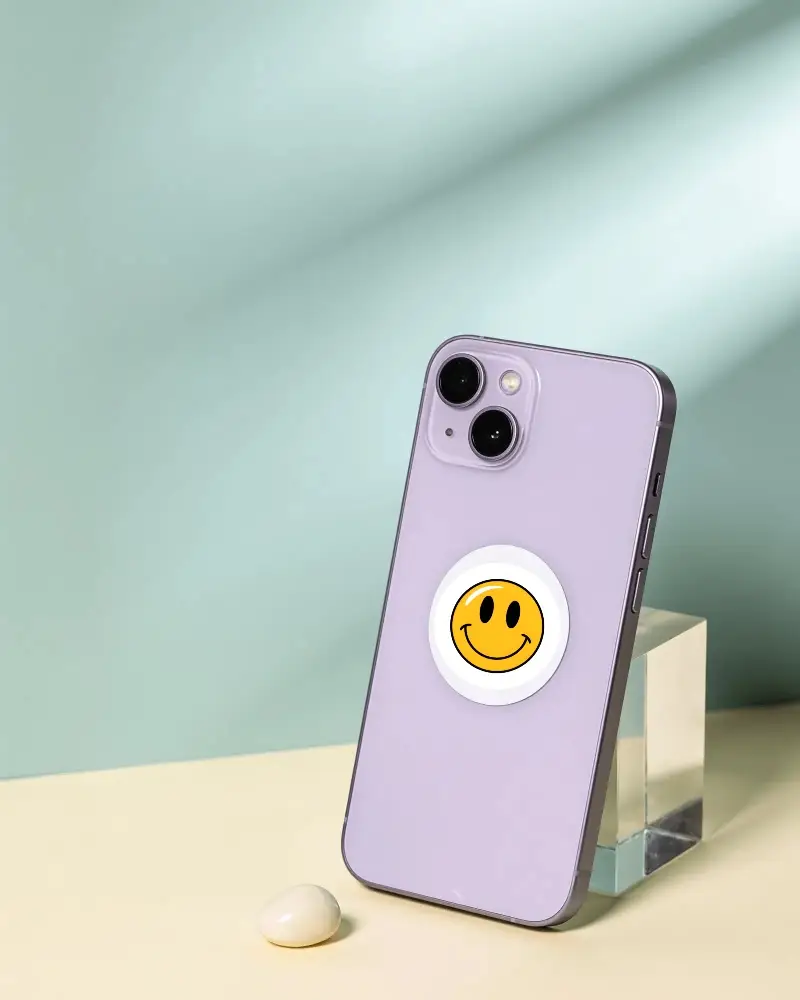 Modern Smartphone With Circular Sticker Mockup Facing Slightly Sideways On Stand