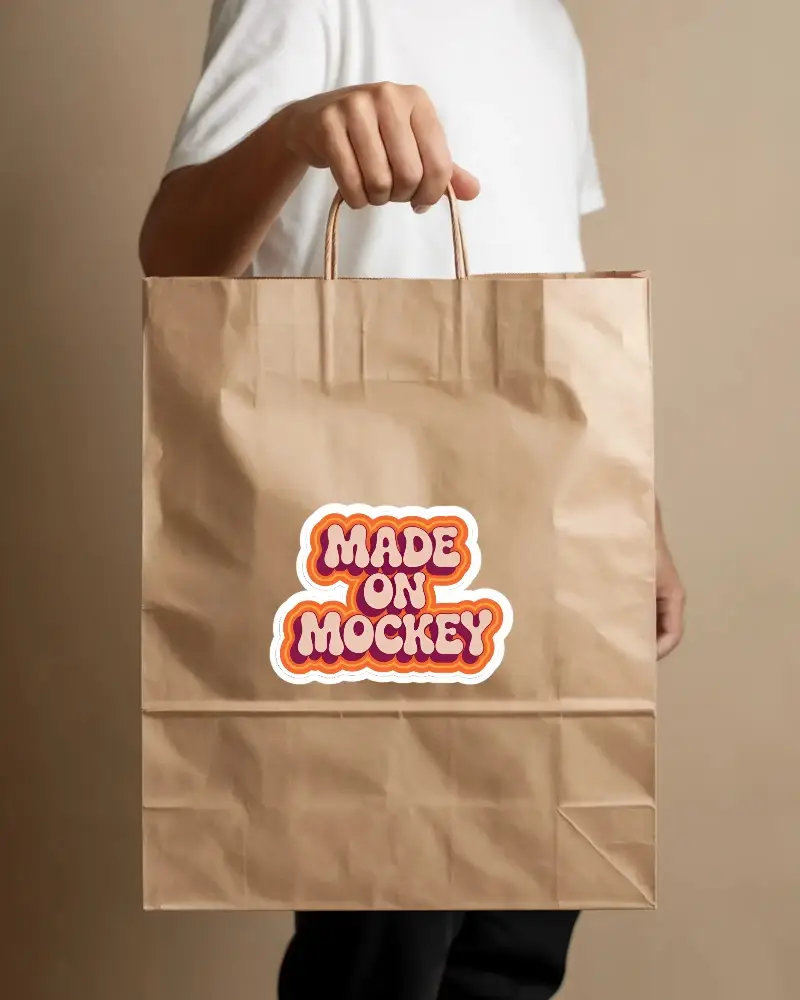 Hand Holding Kraft Paper Bag Sticker Mockup For Eco Friendly Retail Branding Presentation