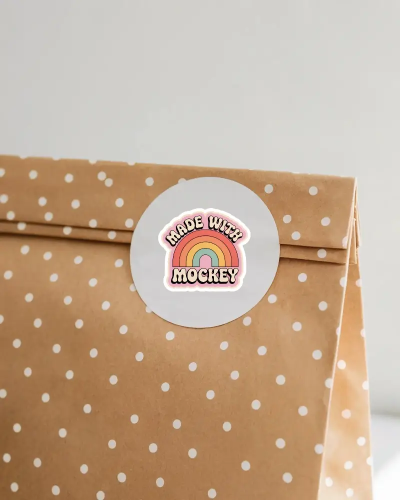 Round Blank Sticker Mockup On Polka Dot Paper Bag Ideal For Branding Labels And Packaging Designs