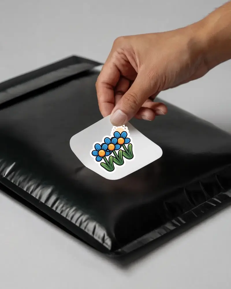 Minimalistic Square Peel Off Sticker Mockup On Protective Black Bubble Mailer Envelope