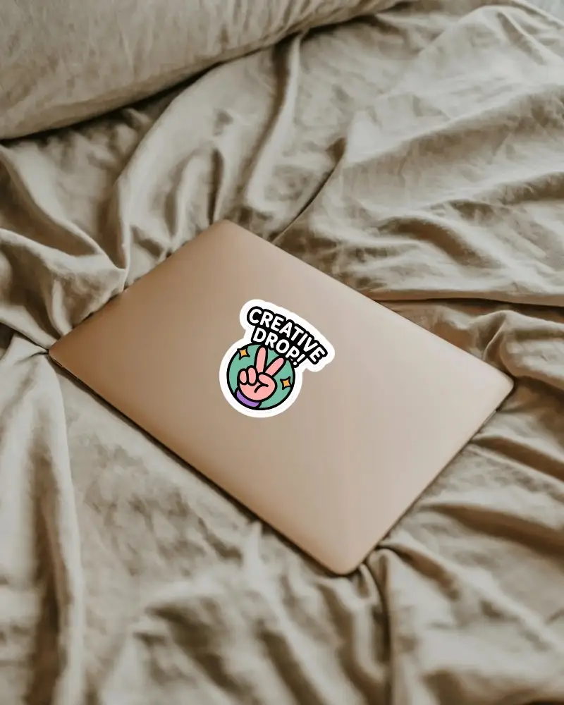Sticker Mockup On Slim Laptop Device Placed On Crumpled Cotton Fabric