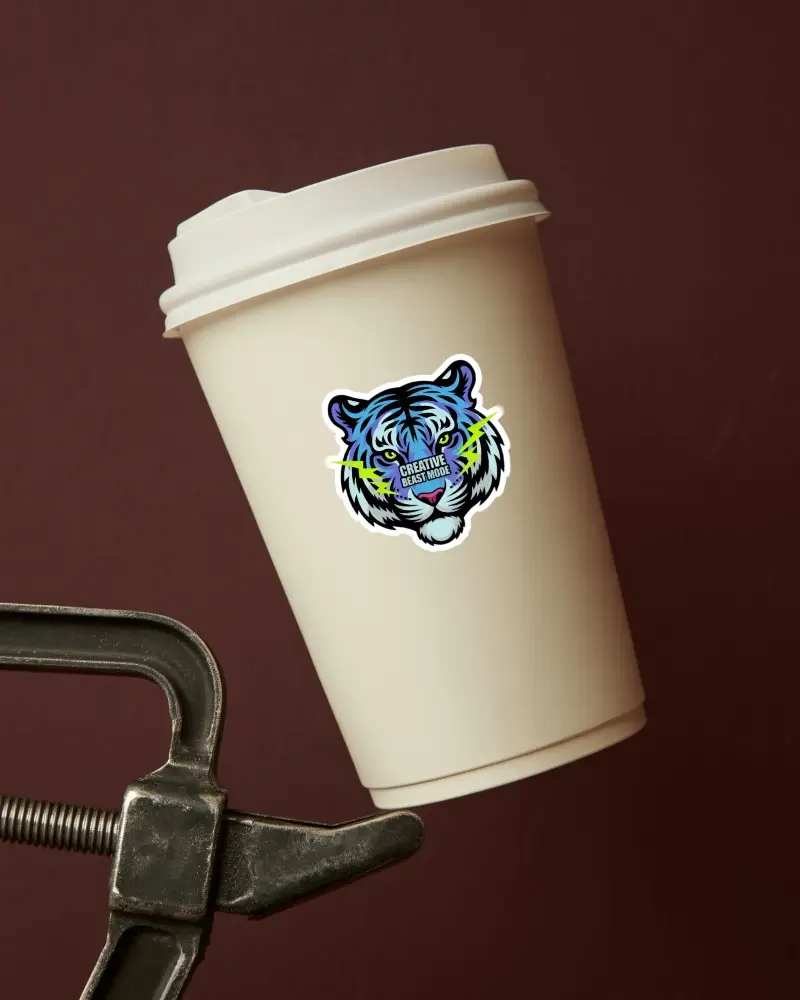 Cream Paper Cup Sticker Mockup Held In Metal Clamp On Dark Red Background Clean Display