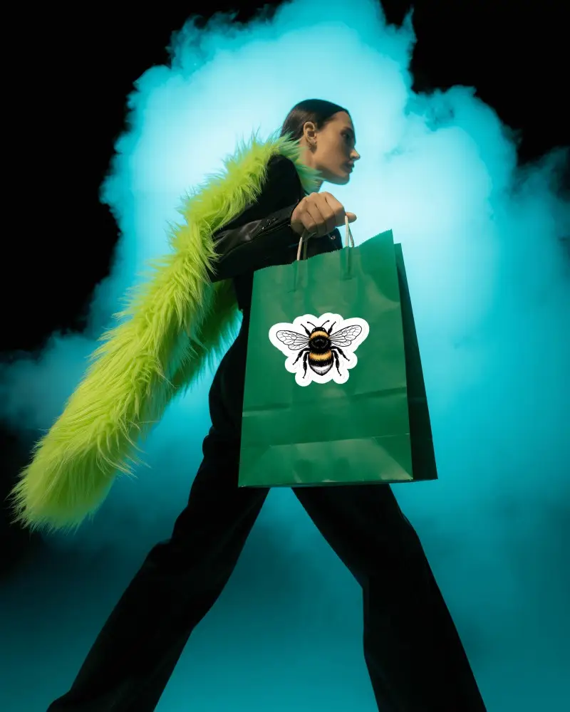 Sticker Mockups Fashion Model Walking With Green Shopping Bag And Bold Fur Scarf In Dramatic Smoke