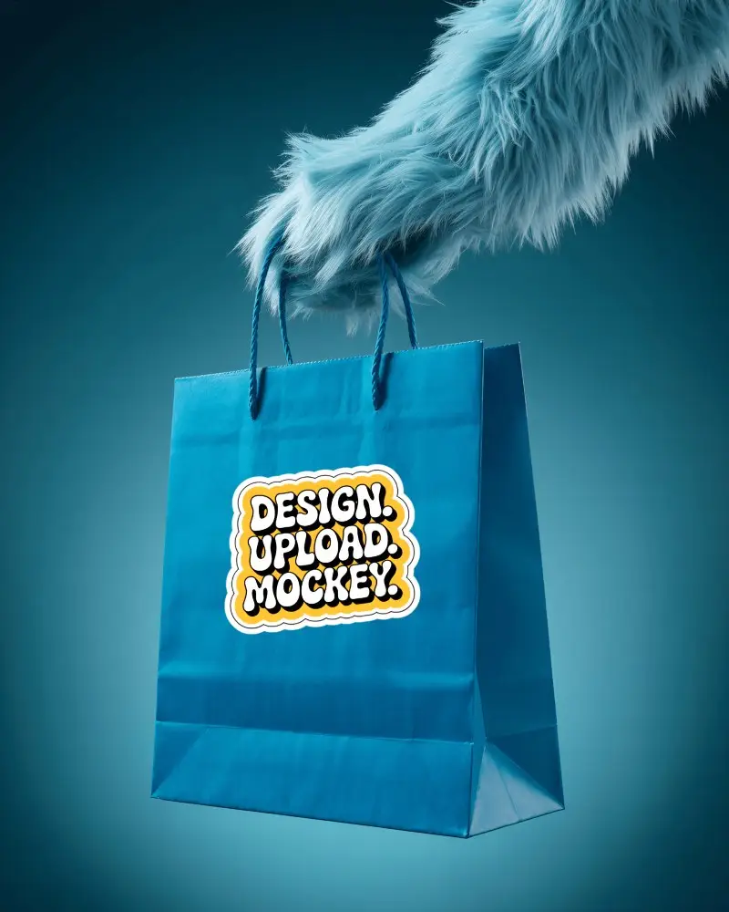 Sticker Mockups Blue Shopping Bag Held By Furry Hand In Minimal Studio With Cool Tone Background
