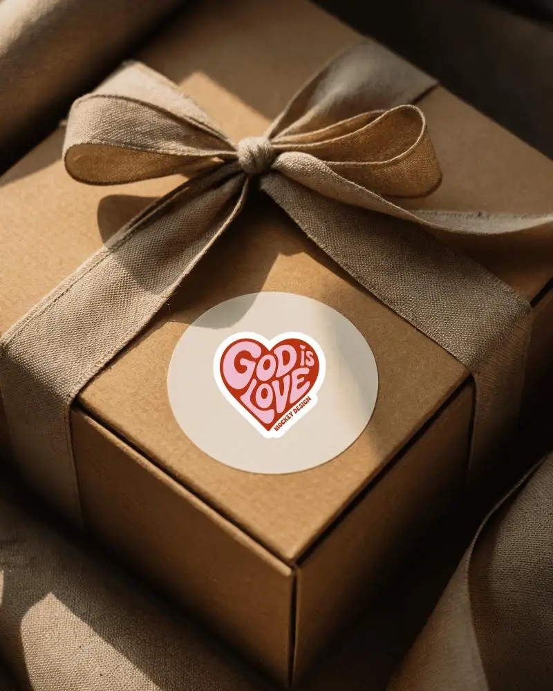 Gift Box Sticker Mockup Round Label On Kraft Box With Fabric Ribbon Warm Natural Light