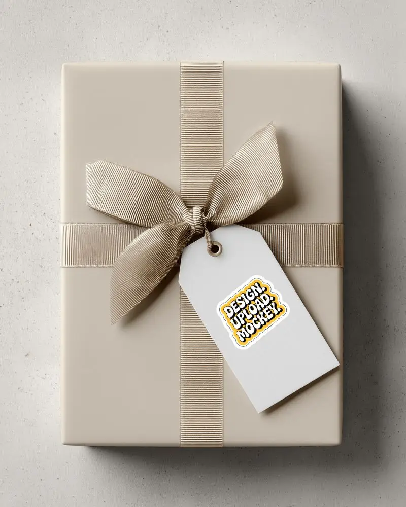 Gift Box Tag Sticker Mockup Blank Hanging Label On Elegant Wrapped Present With Ribbon Top View