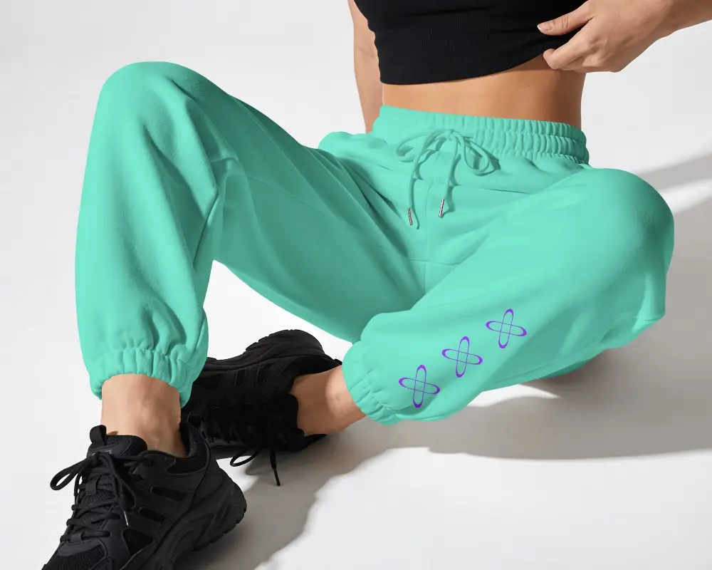 Seated Womens Sweatpants Mockup Close Up With Jogger Cuffs And Black Sneakers In Minimal Studio