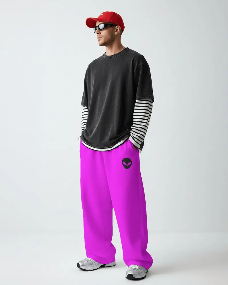 Streetwear Sweatpants Male Model Wearing Wide Leg Bottoms With Layered Top And Cap Styling