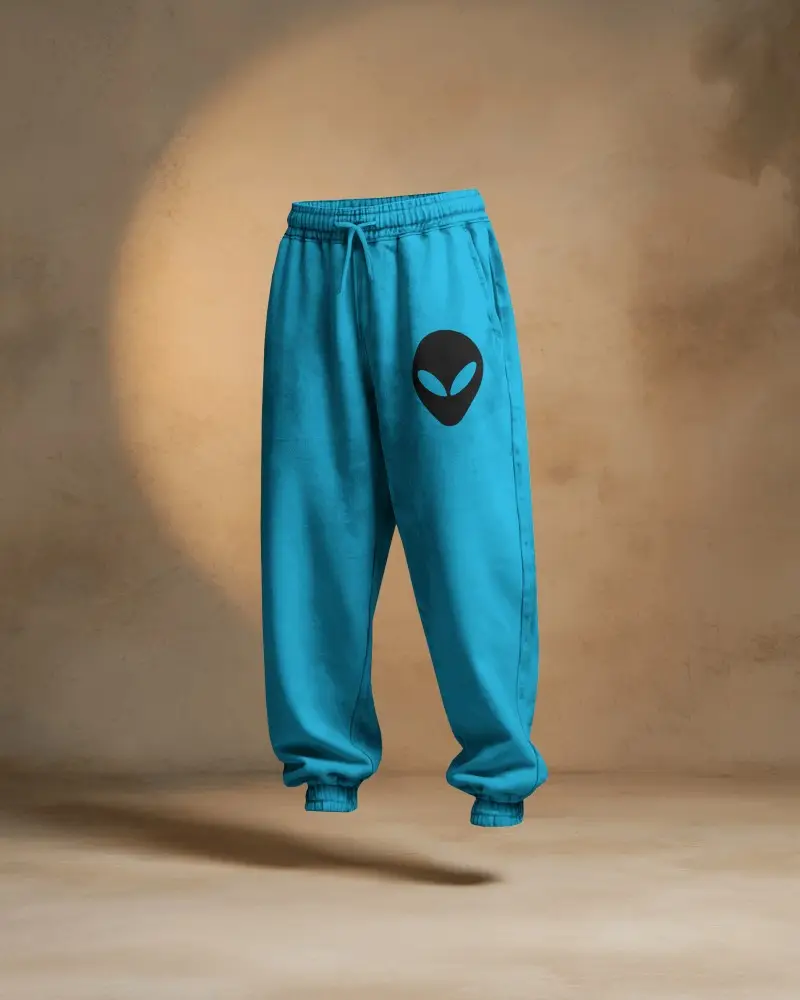 Floating Sweatpant Mockup Against Textured Studio Wall With Soft Dramatic Lighting