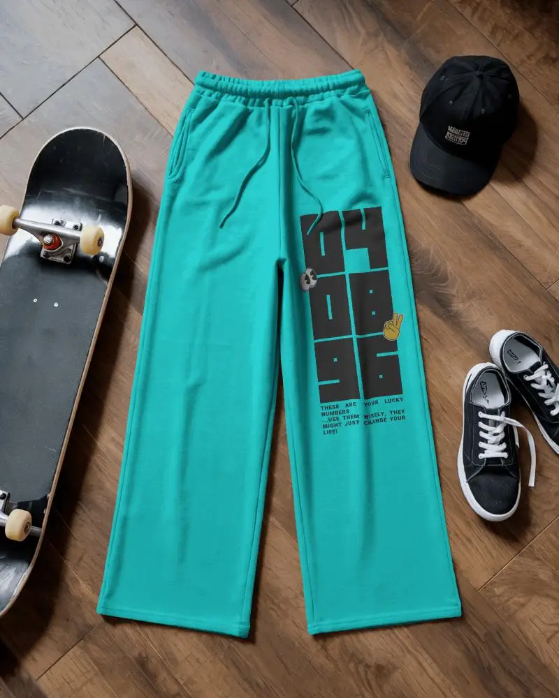 Flatlay Wide Leg Sweatpant Mockup On Wooden Floor With Skateboard Cap And Casual Sneakers