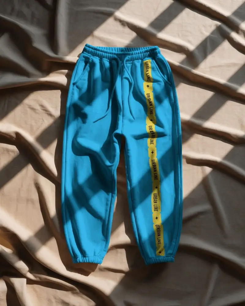 Flatlay Sweatpant Mockup On Creased Fabric Surface With Window Shadows Creating Dramatic Look