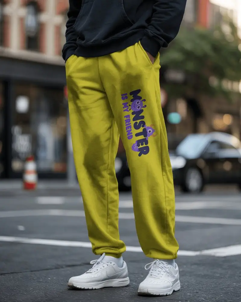 Male Model Wearing Sweatpant Mockup On Urban Street Paired With White Sneakers Casual Style