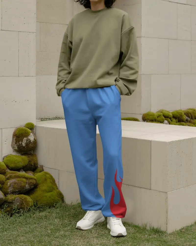 Serene Garden Sweatpants Mockup Relaxed Model Standing By Stone Wall With Soft Moss Detail