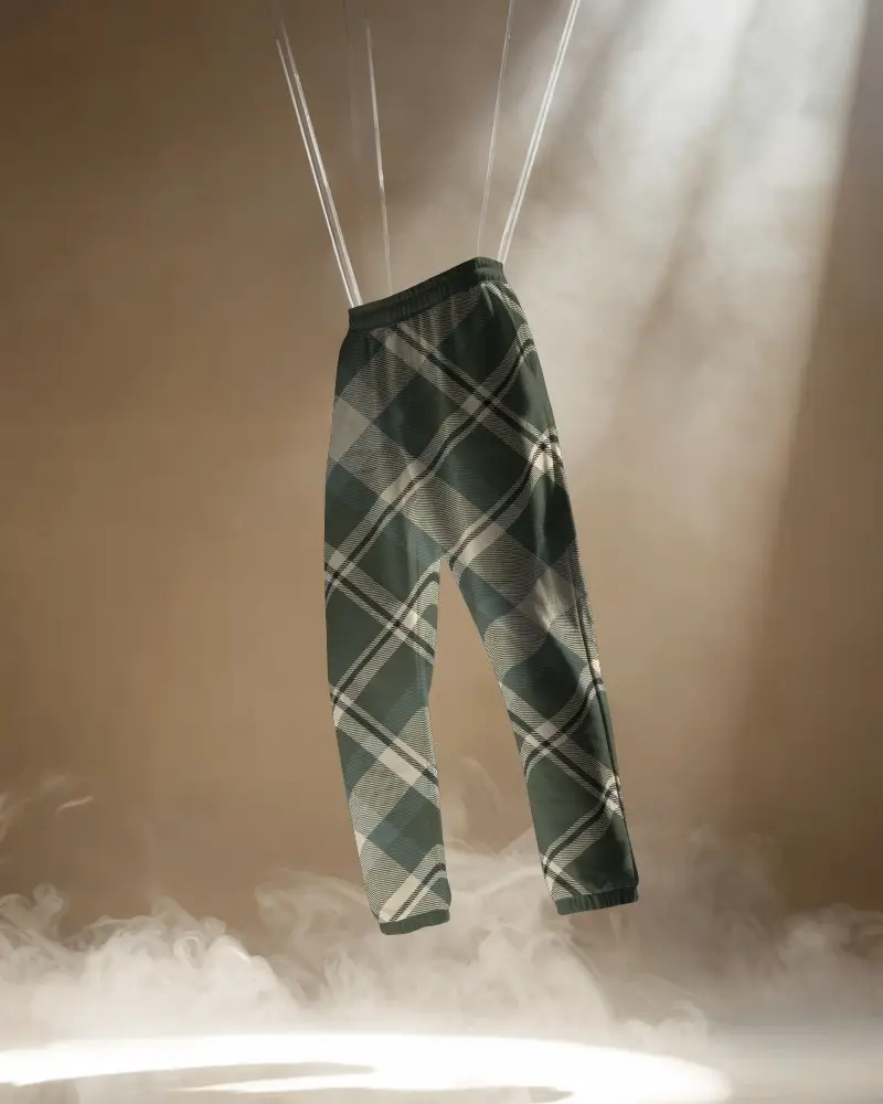 Elegant Sweatpants Mockup Suspended On Ropes With Dramatic Spotlight And Fog