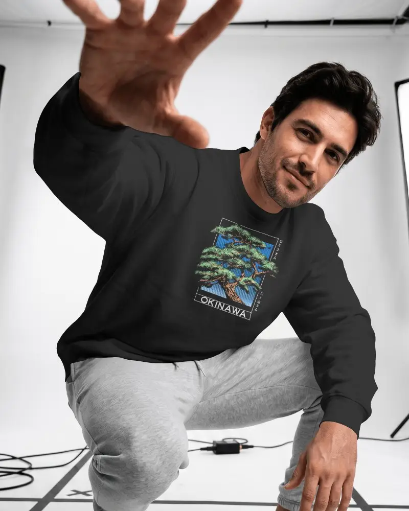 White Studio Sweatshirt Mockup Male Model Crouching Forward With Dynamic Hand Reach Pose