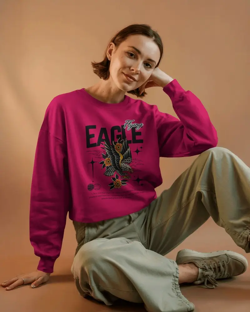 Warm Studio Sweatshirt Mockup Female Model Sitting On Floor Soft Orange Background Relaxed Pose Cozy Lighting Modern Casual Style