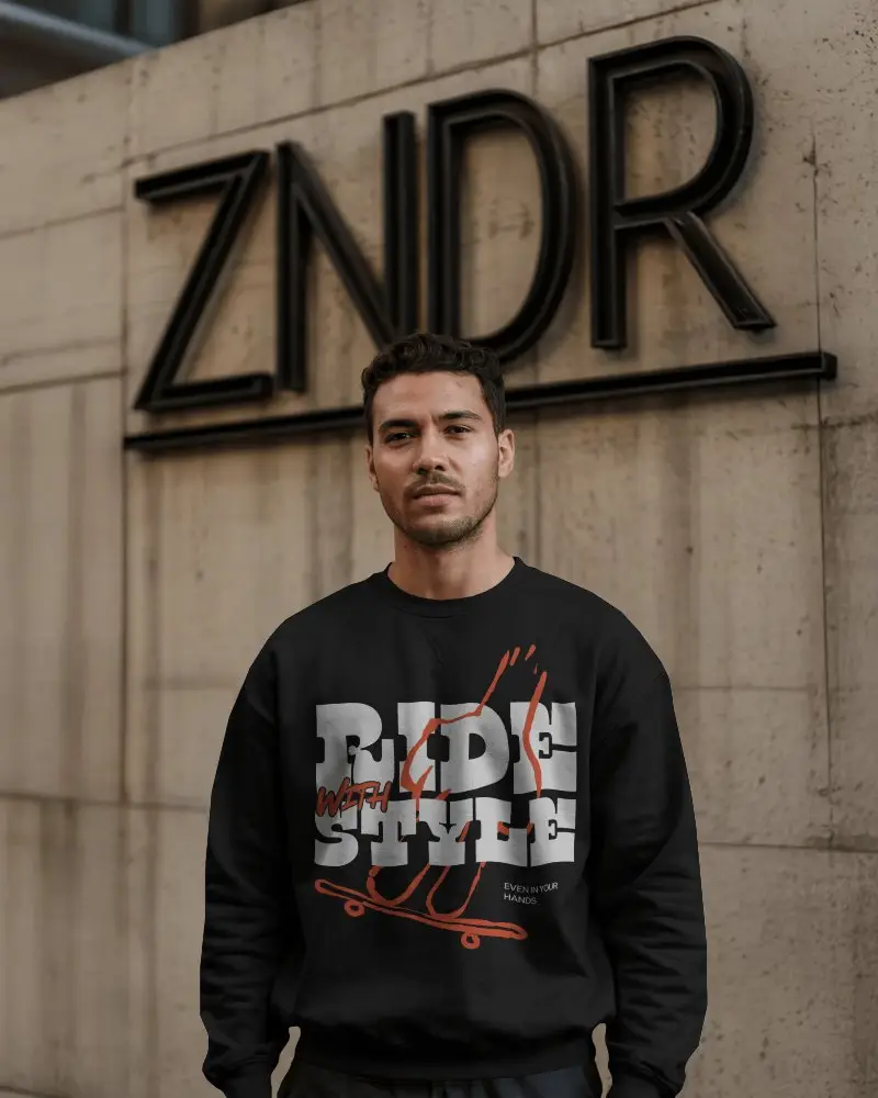 Urban Wall Sweatshirt Mockup Male Model Standing In Front Of Modern Building Signage Moody Lighting Minimalist Streetwear Vibe
