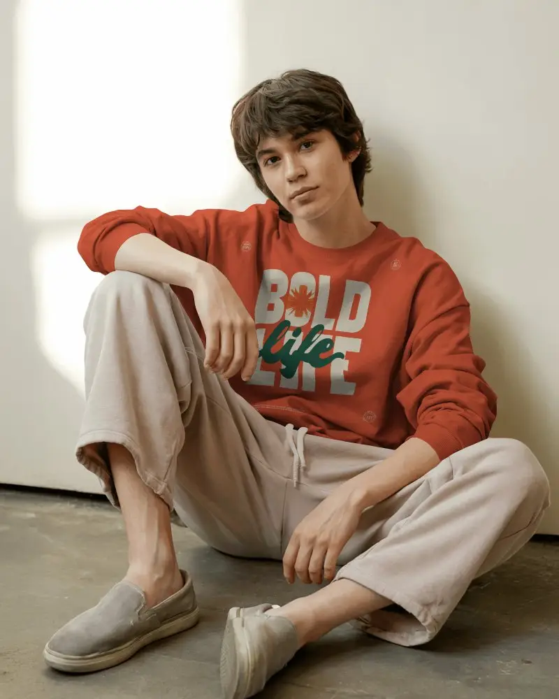 Relaxed Floor Pose Sweatshirt Mockup Male Model In Casual Style With Natural Light Setting