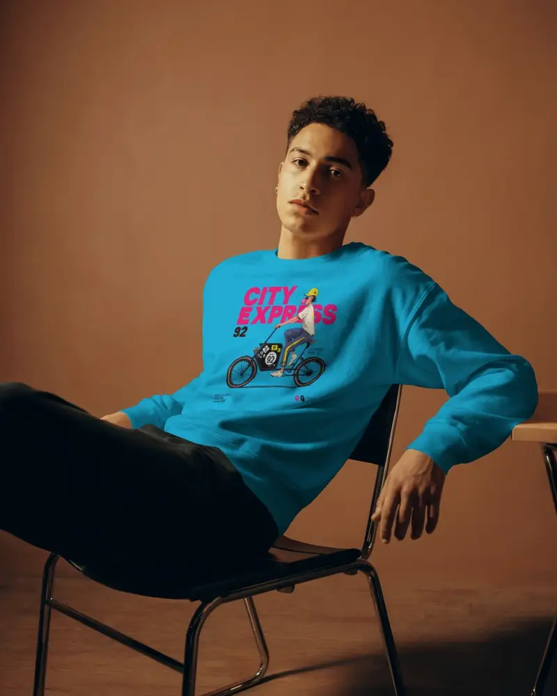 Relaxed Studio Sweatshirt Mockup Male Model Sitting On Chair In Casual Outfit With Brown Backdrop