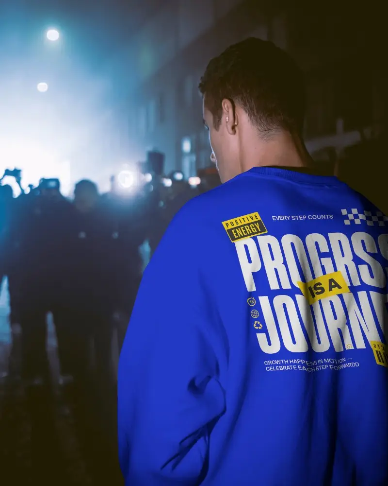 Sweatshirt Mockup Back View Male Model In Nighttime Street Scene With Crowd And Cinematic Lights