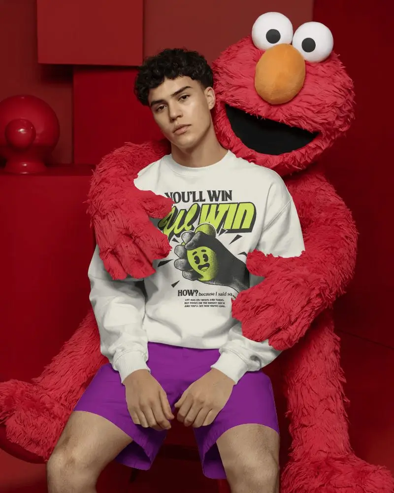 Creative Sweatshirt Mockup Male Model With Red Character Playful Studio Setting