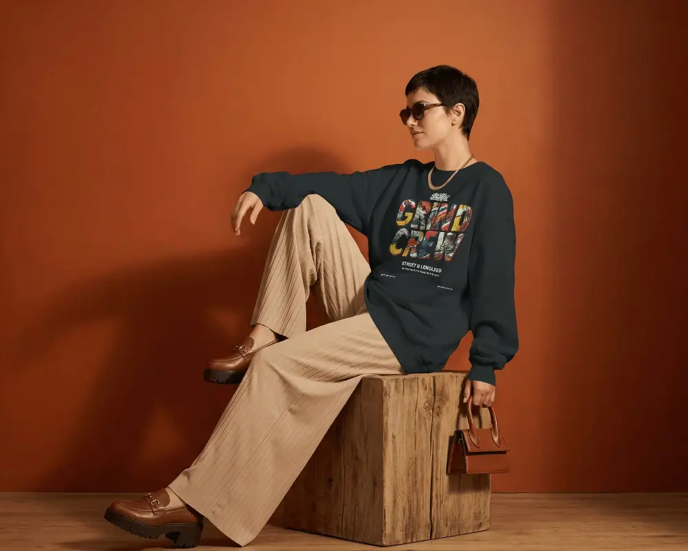 Studio Sweatshirt Mockup Fashion Model Sitting On Wooden Block Warm Orange Background Modern Style