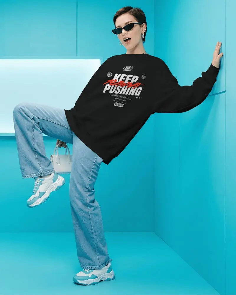 Dynamic Pose Sweatshirt Mockup Female Model Leaning On Wall Blue Studio Fashion Scene