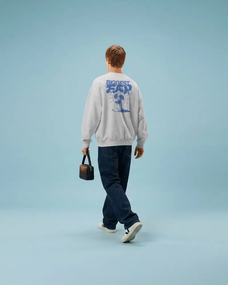 Lifestyle Sweatshirt Mockup Male Model Walking Away With Bag Minimal Blue Background