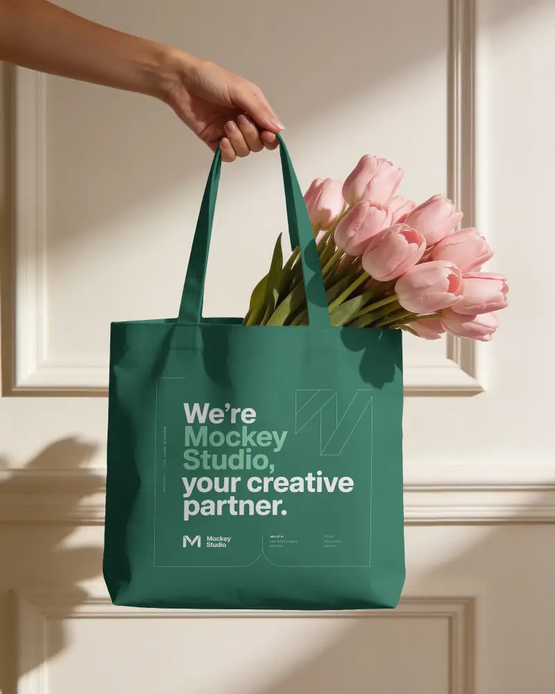 Hand Held Reusable Tote Bag Mockup With Fashionable Flower Display For Design Presentation
