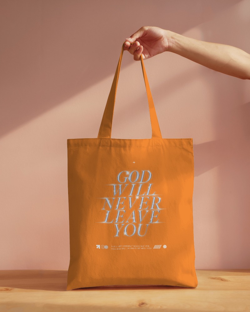 Minimalist Indoor Setting White Tote Bag Mockup Hand Holding Peach Wall