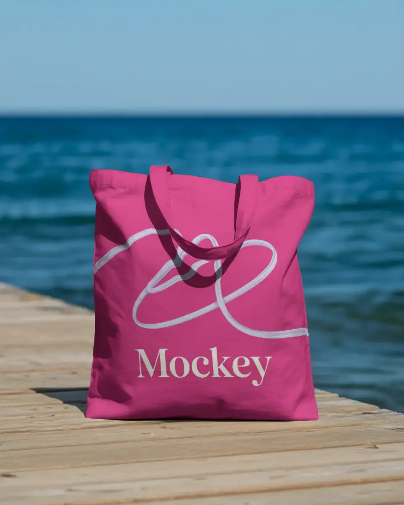 Blank Cotton Tote Bag Mockup On Wooden Deck By The Serene Ocean Background