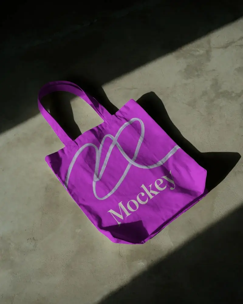 Minimalist Tote Bag Mockup On Concrete Floor With Dramatic Lighting Modern Eco Lifestyle Design