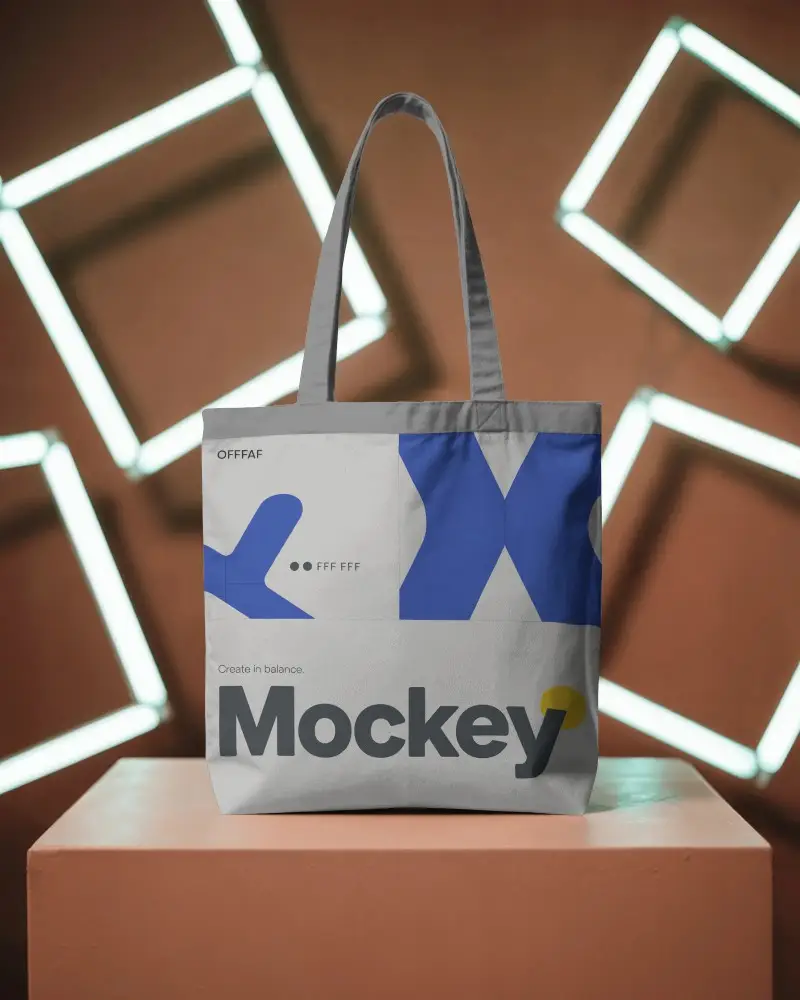 Glowing Neon Studio Tote Bag Mockup On Pedestal Modern Futuristic Brand Presentation Style