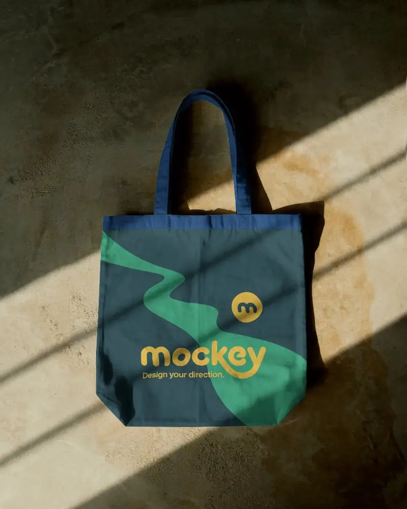 Textured Floor Tote Bag Mockup With Angled Sunlight And Shadows Natural Rustic Display Style