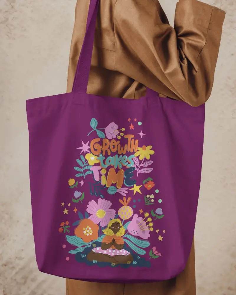 Casual Lifestyle Tote Bag Mockup Held By Female Model In Earth Tone Outfit Against Warm Neutral Background