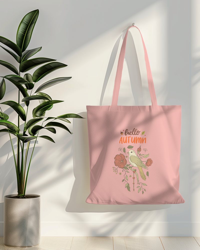Tote Bag Mockup Hanging On White Wall With Plant In Side
