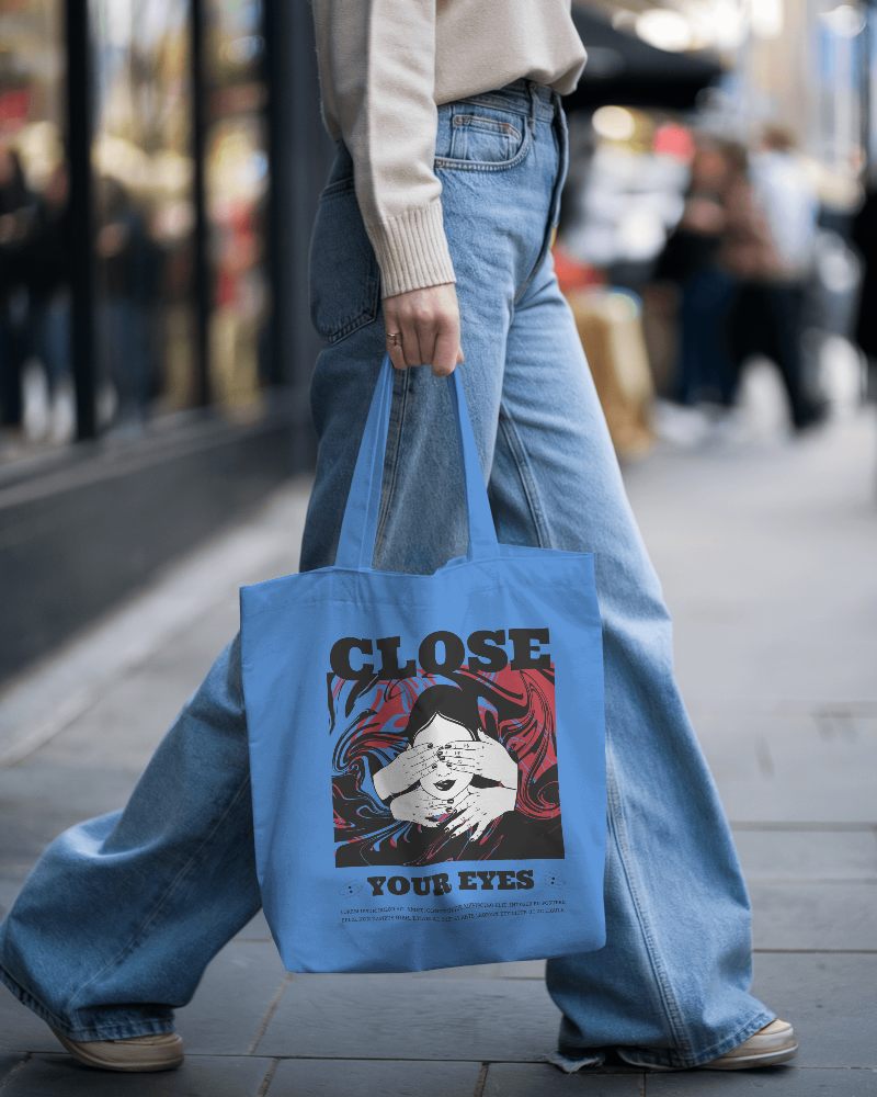 Casual Street Cotton Tote Bag Mockup Female Model Wearing Beige Sweater And Wide Leg Jeans Walking On Busy City Sidewalk 0152