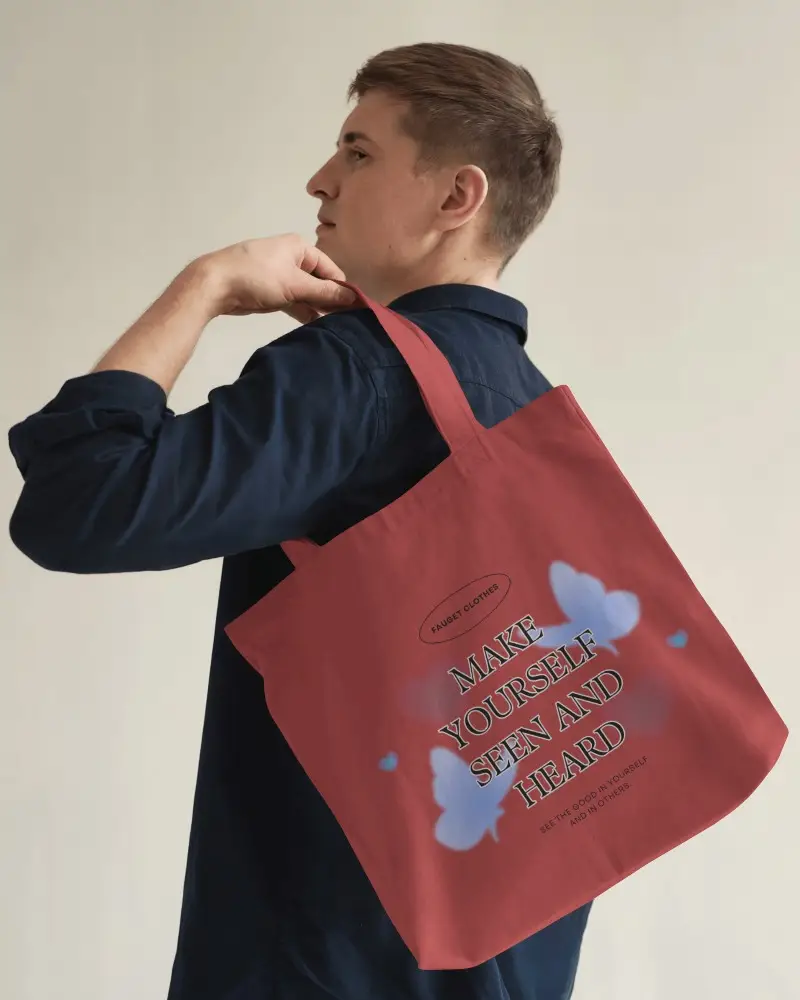 Side Profile Totebag Mockup Over Shoulder Carry Position Male Model Looking Away Clean Minimalist Setting Empowering Typographic Message Soft Light Touch