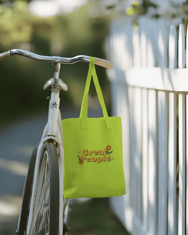 Active Outdoor Totebag Mockup Hanging On Bicycle Handlebars With Greenery In Background Casual And Eco Friendly Ambience