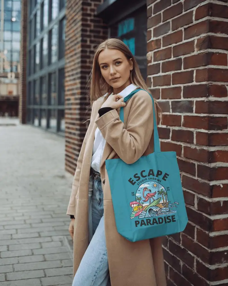 Modern City Tote Bag Mockup On Fashionable Model In Camel Coat By Brick Wall Urban Chic Look