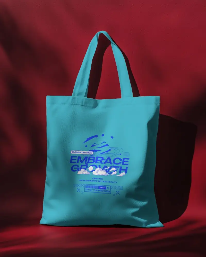 Tote Bag Mockup On Contrasting Red Backdrop With Cosmic Print Dream Typography Design