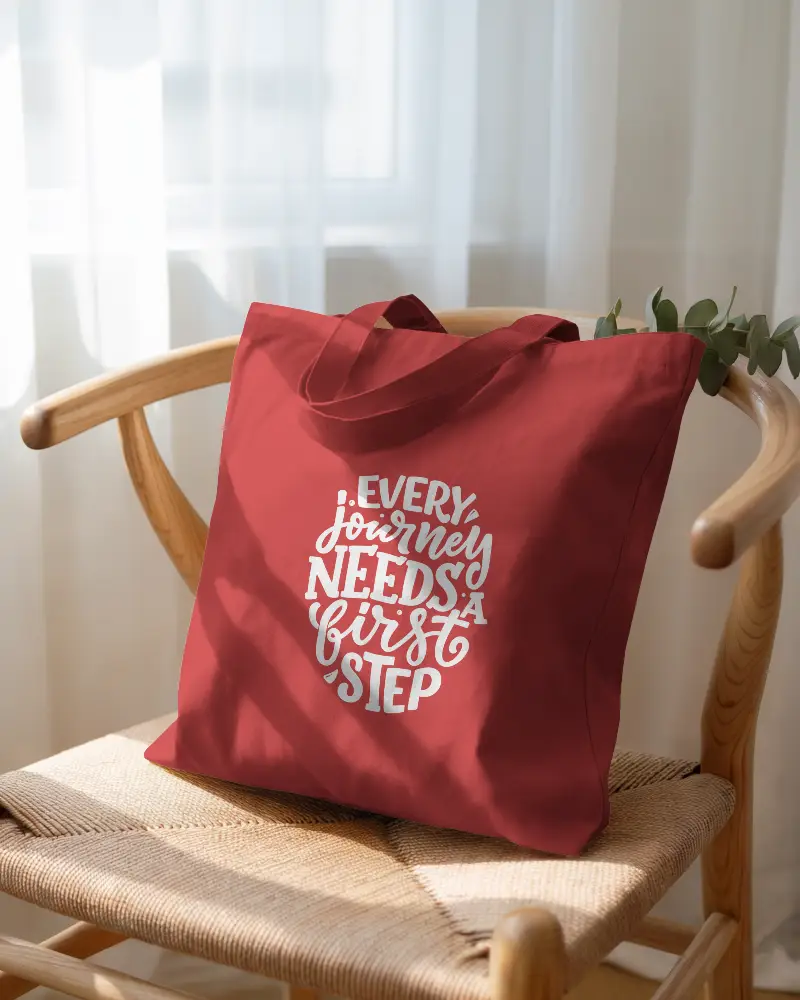 Sunlit Interior Tote Bag Mockup White Fabric Bag On Wooden Chair With Curtain Backdrop 0287