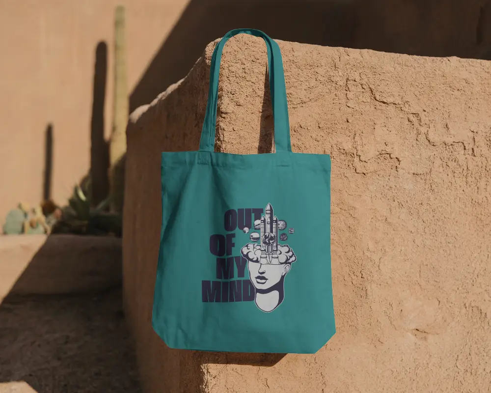 Outdoor Desert Wall Tote Bag Mockup Hanging On Textured Adobe Surface With Cactus Shadow Play 0290