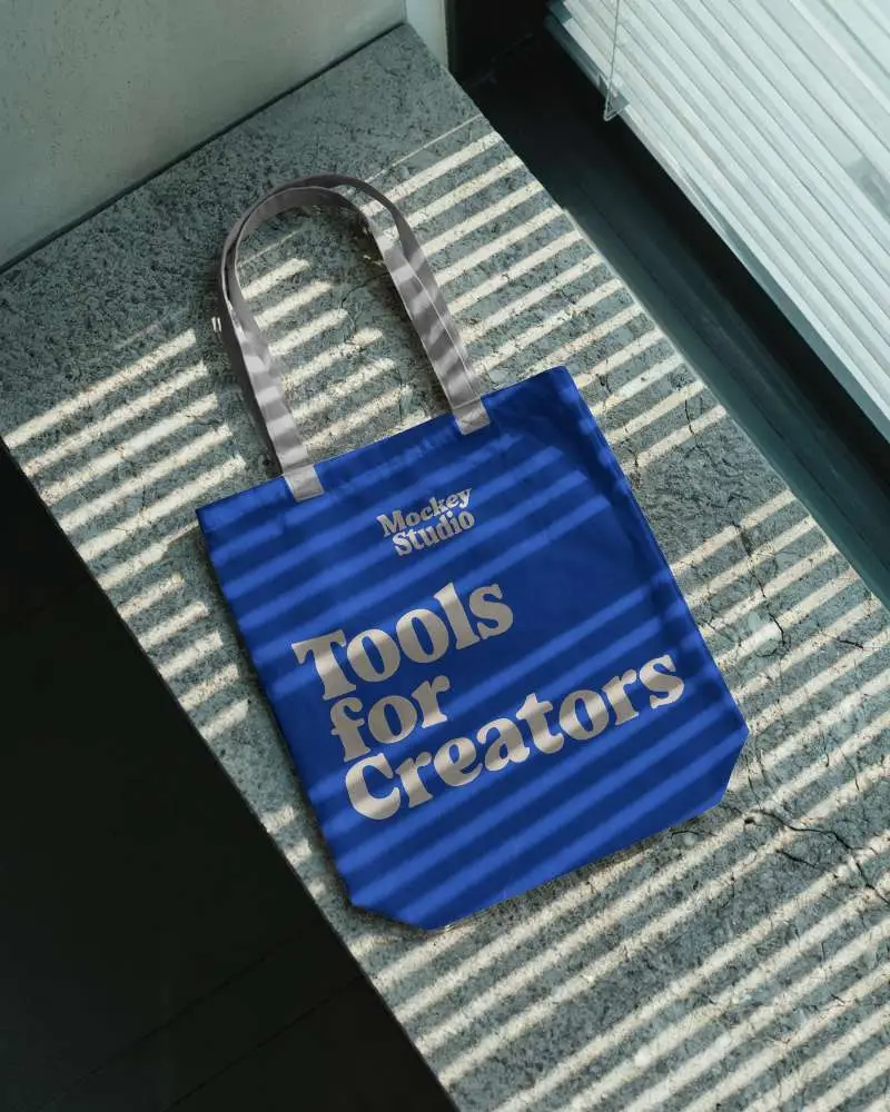 Minimalistic Canvas Tote Bag Laying On Textured Surface With Natural Light Patterns 0305